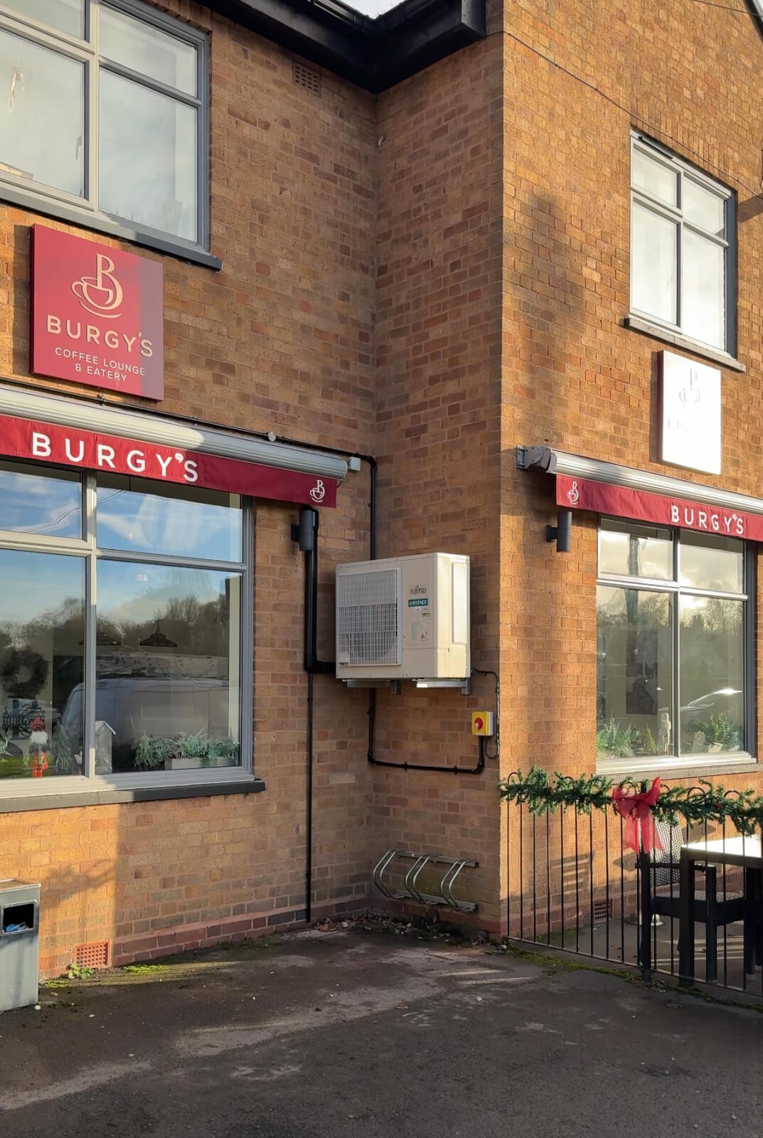 Air Conditioning outdoor unit outside a coffee shop