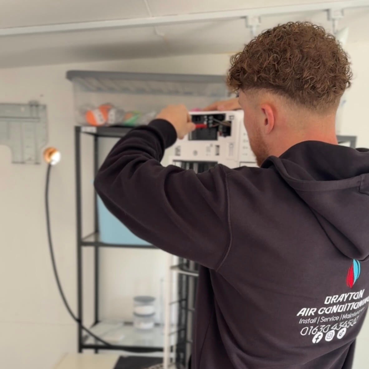 air conditioning installer wiring the indoor unit